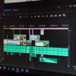 Close-up of a video editing timeline interface on a computer screen, showcasing professional software in action.