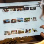 A woman exploring Adobe Lightroom tutorials online for learning and photo editing.